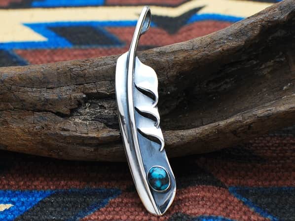 .WING FEATHER WITH TURQUOISE.